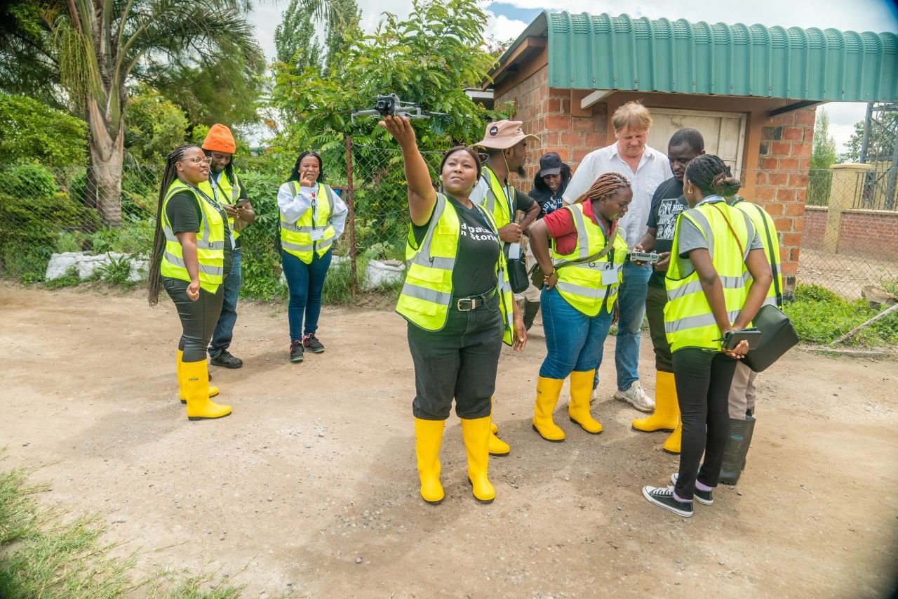 Ivan Buendía Gaytán with the community drone mapping team in the field, Lusaka, March 2026. | Photo: Abednego Chanda