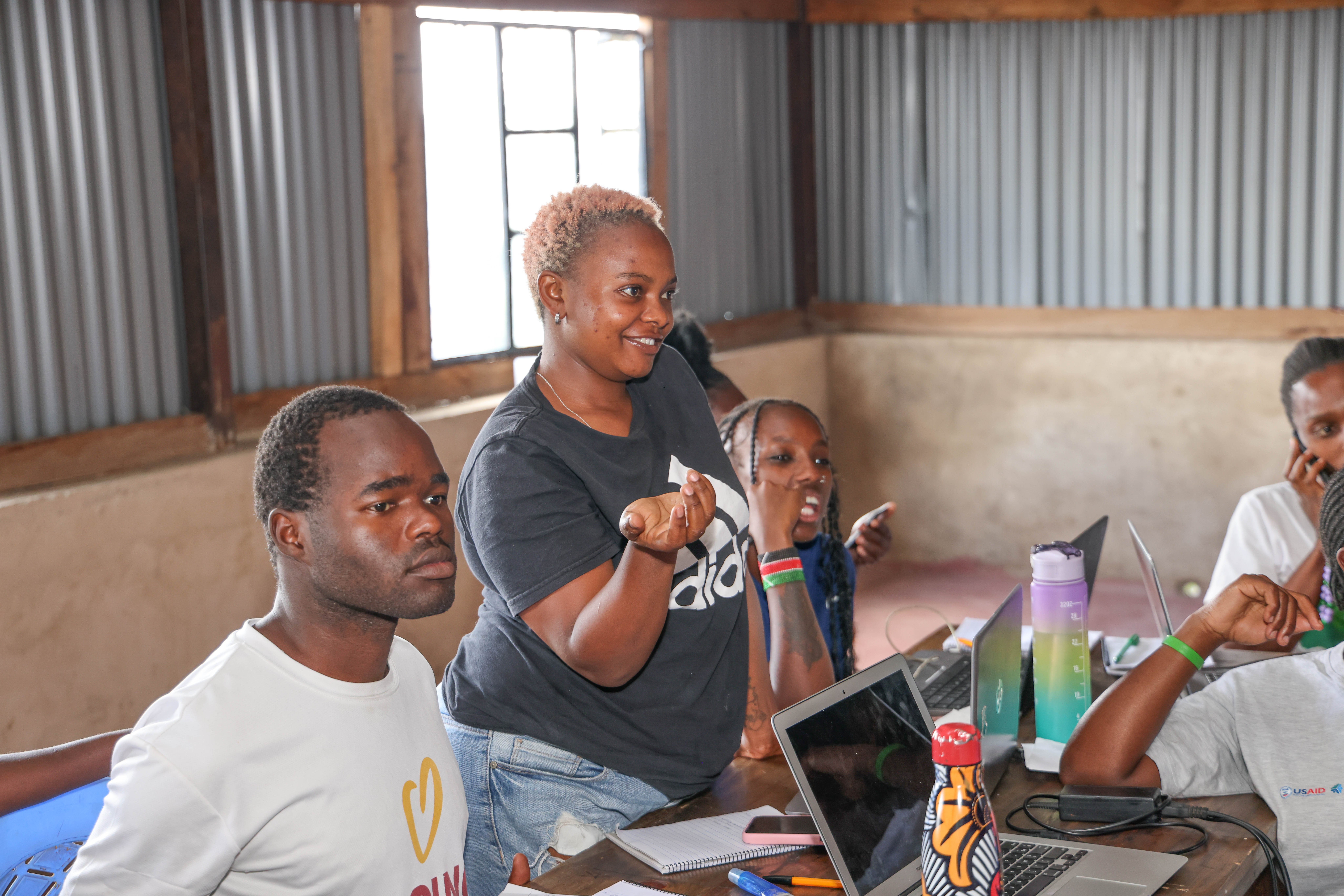 Vivian, pictured above in a black t-shirt, Muungano wa Wanavijiji youth, Mathare. | Photo: HOT / SDI Kenya