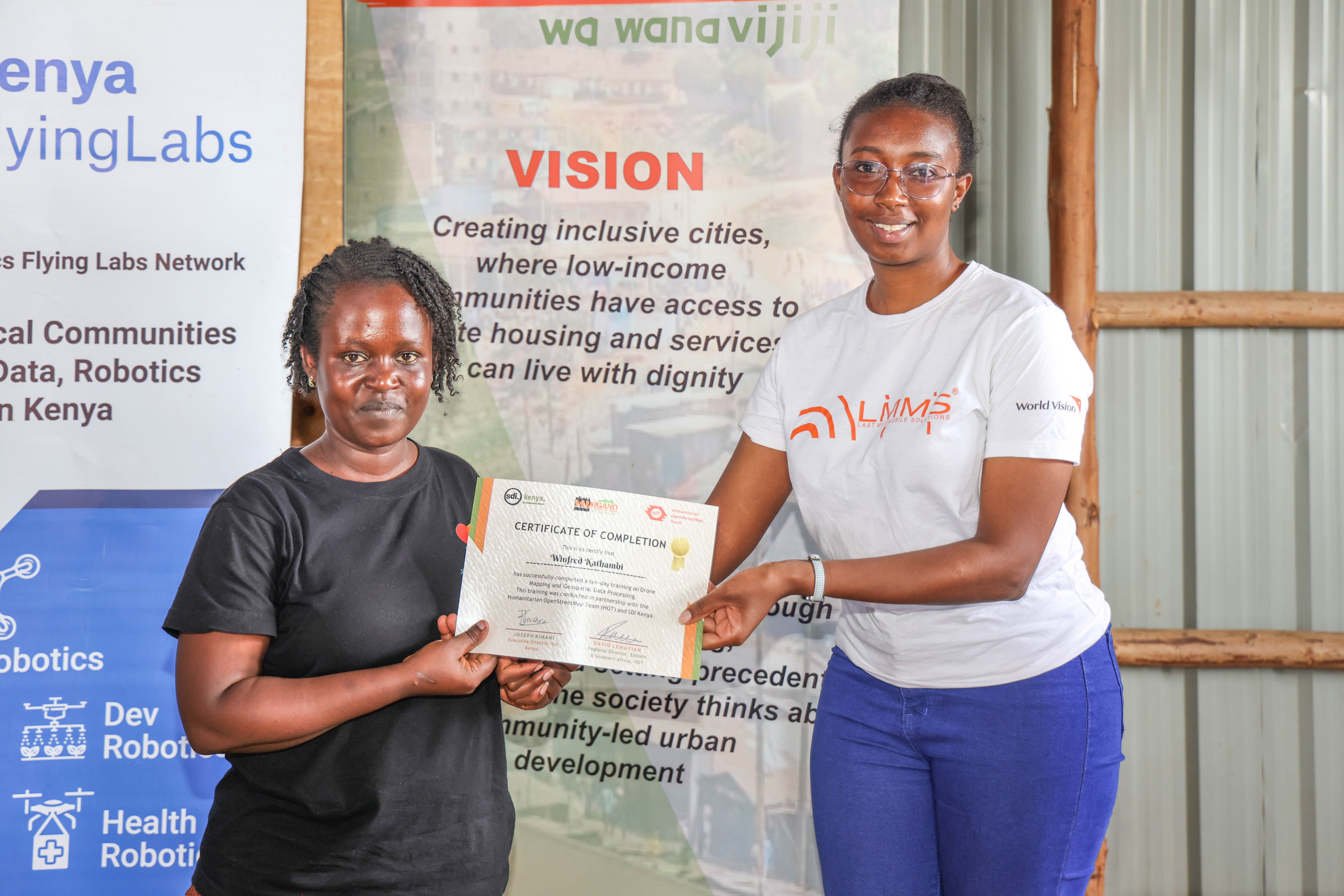 SDI Kenya team members join HOT staff in presenting certificates to community youth at the KYC Nairobi certification ceremony, Mathare. | Photo: HOT / SDI Kenya