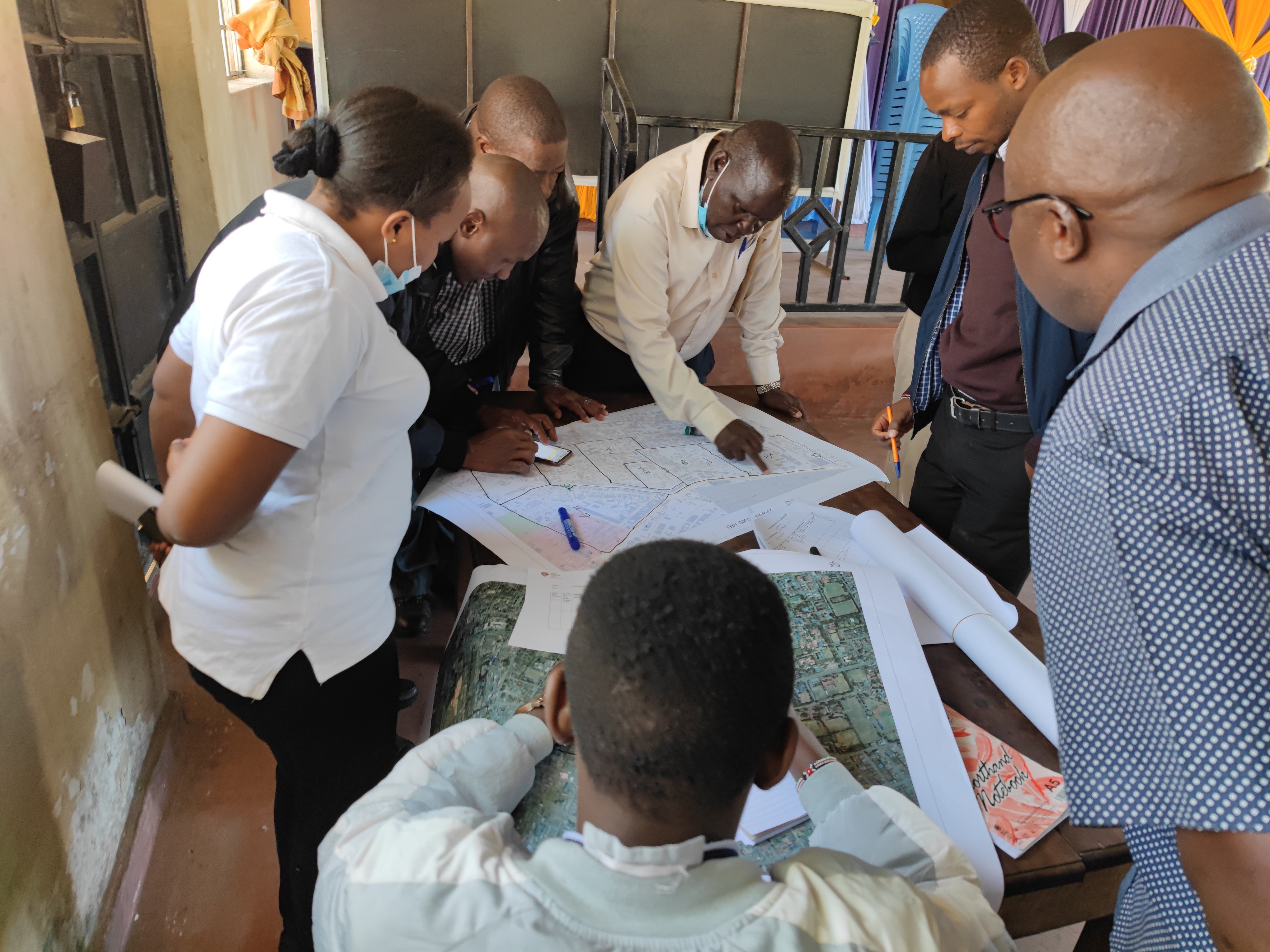 Community members participating in field mapping in Nakuru