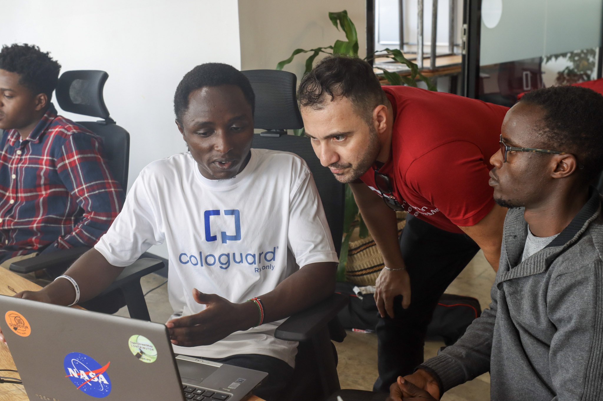 Mappers experimenting with GeoAI models with Omran Najjar during hands-on sessions in Nairobi. Photo: Pauline Omagwa